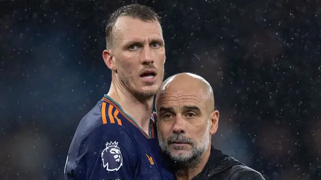 Dan Burn and Pep Guardiola