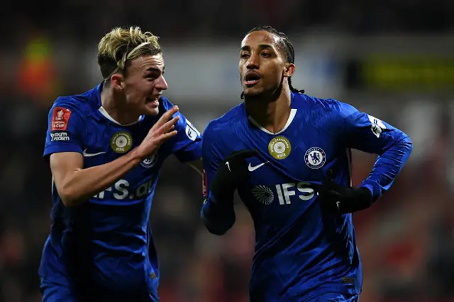 Joao Pedro (R) celebrates