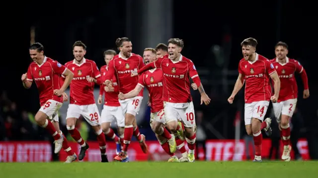 The players of Wrexham celebrate after beating Nottingham Forest