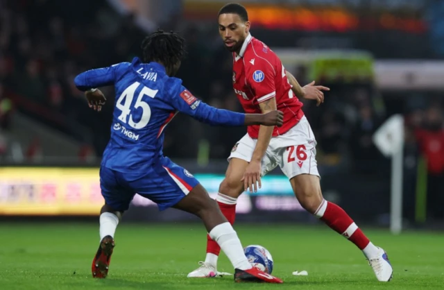 Wrexham's Zak Vyner in action with Chelsea's Romeo Lavia