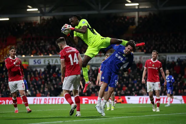 Marc Guiu of Chelsea is challenged by Arthur Okonkwo of Wrexham