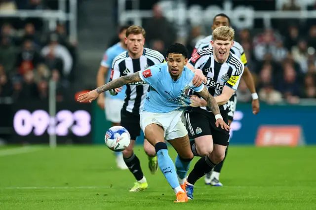 Savinho is put under pressure by Newcastle United's English midfielder Lewis Hall