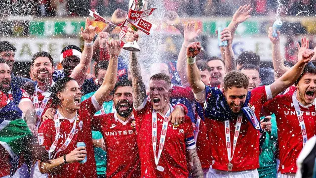 Wrexham celebrate winning promotion to the championship