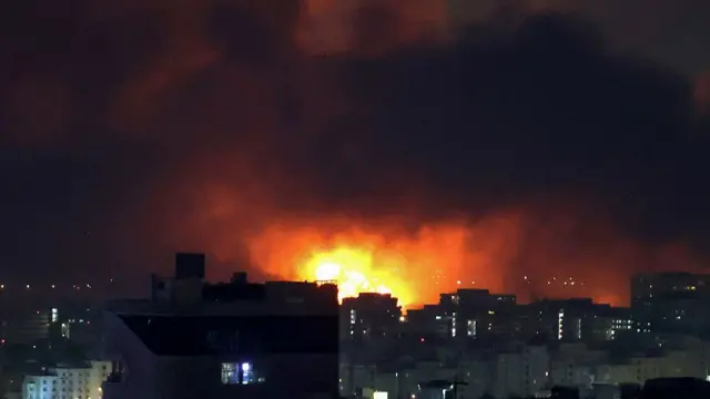 Smoke and fire rise from the site of airstrikes at Mehrabad International Airport in Tehran on March 7, 2026.
