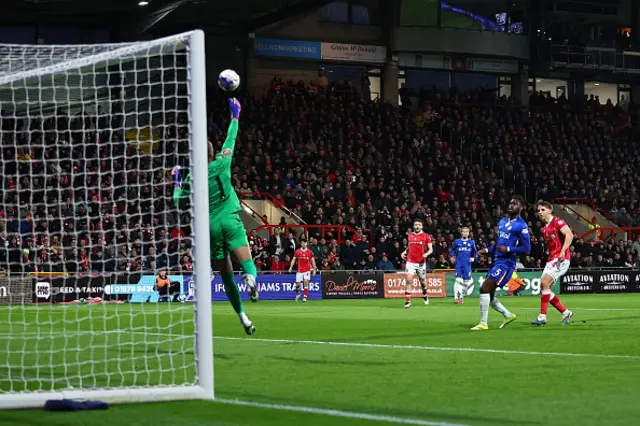 Robert Sanchez of Chelsea saves from Max Cleworth