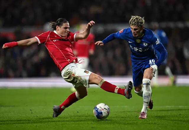Alejandro Garnacho of Chelsea is challenged by George Dobson