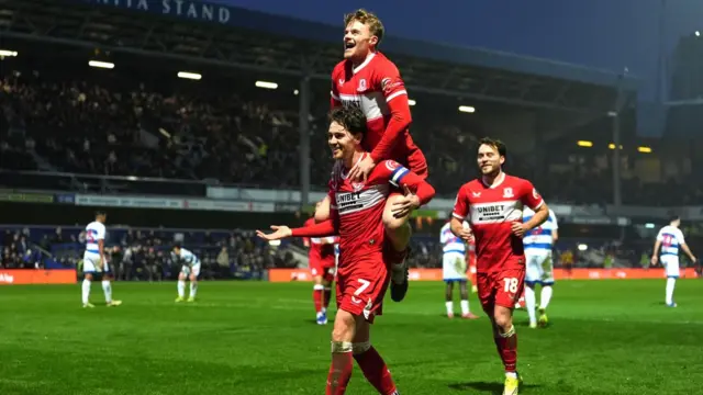 Tommy Conway jumps on the back of Hayden Hackney in celebration