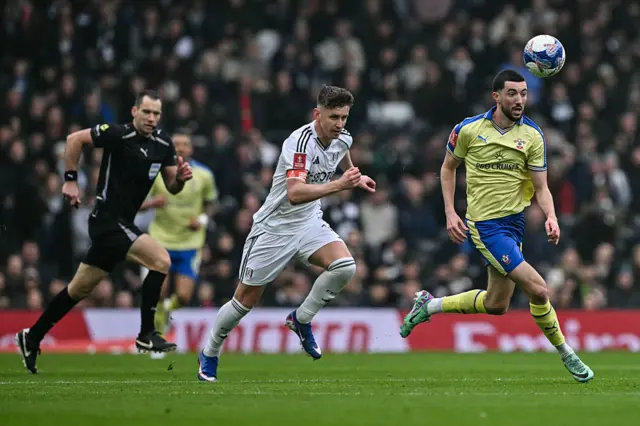 Tom Cairney challenges Finn Azaz