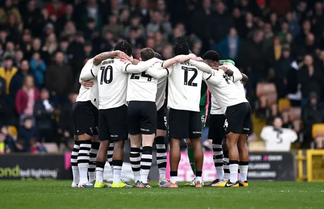 Players of Port Vale huddle