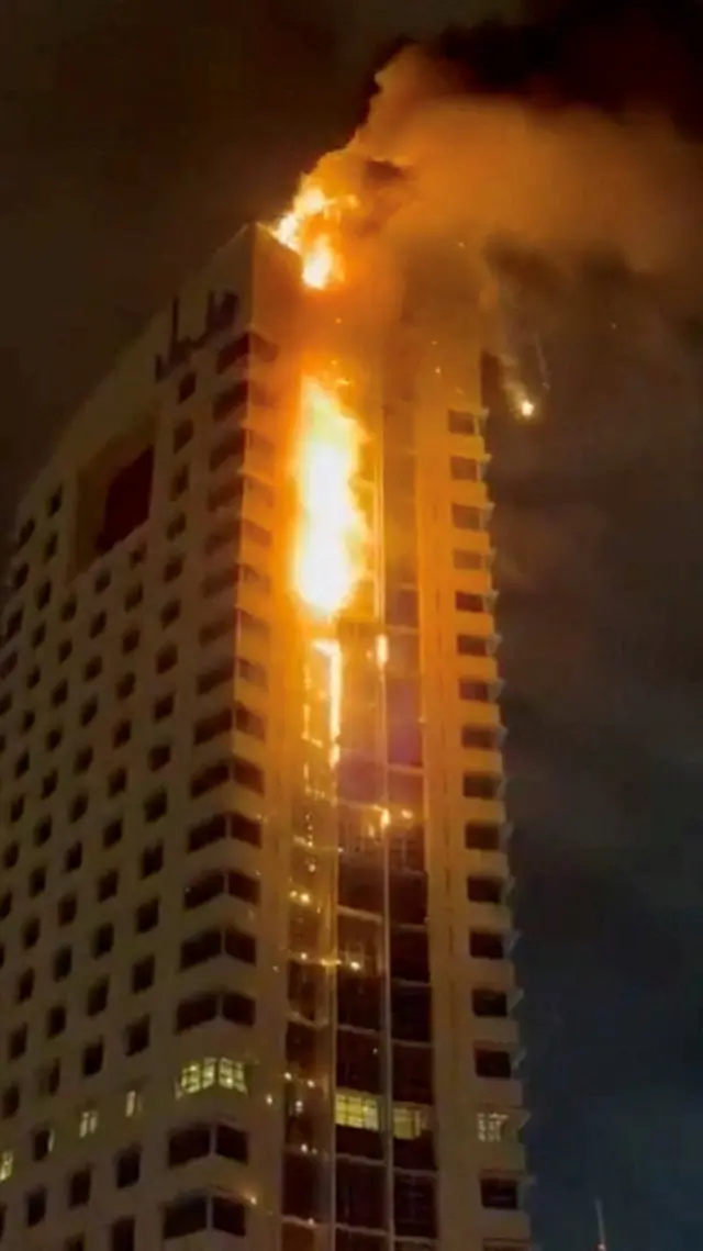 Building in Kuwait City in flames following drone attack