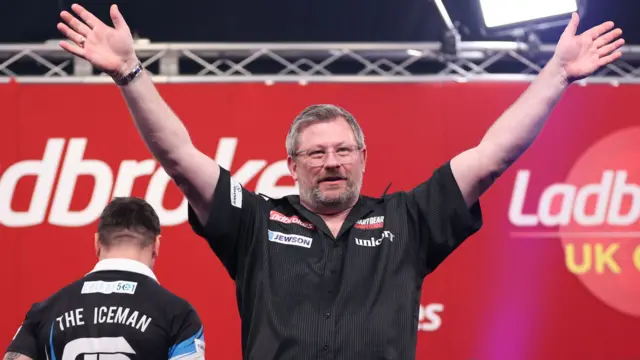 James Wade waves
