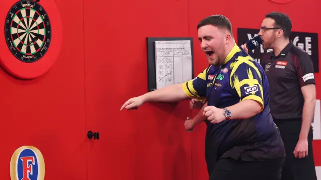 Luke Littler celebrates