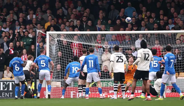 Ben Waine of Port Vale scores his team's first goal