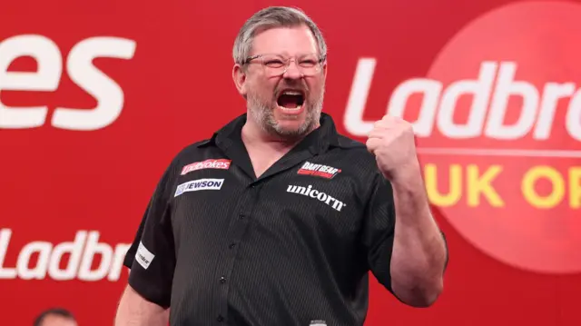 James Wade celebrates