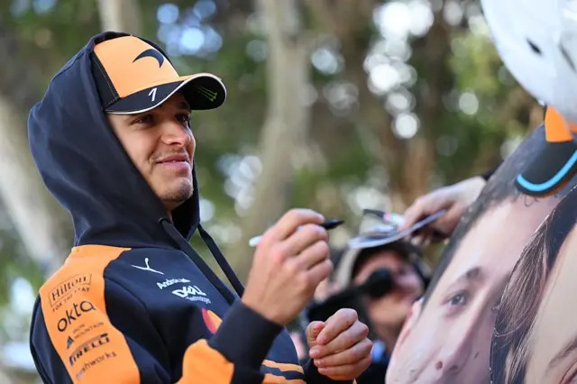 Lando Norris signs autographs for fans in Melbourne