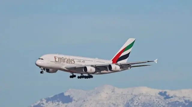An Emirates plane lands into Barcelona airport