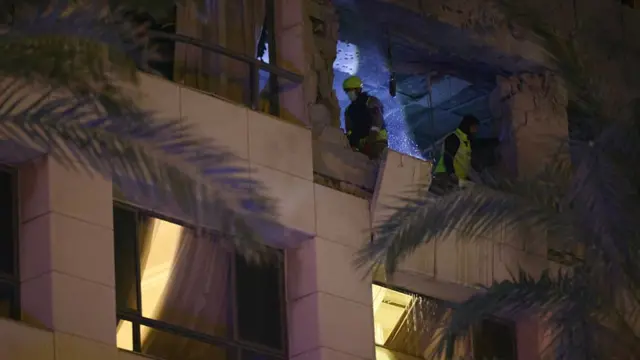 First responders inspect damage at a Ramada Hotel in Beirut