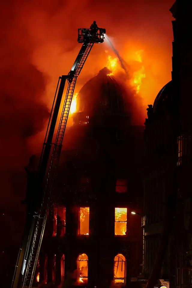 A firefighter battling the fire in Glasgow