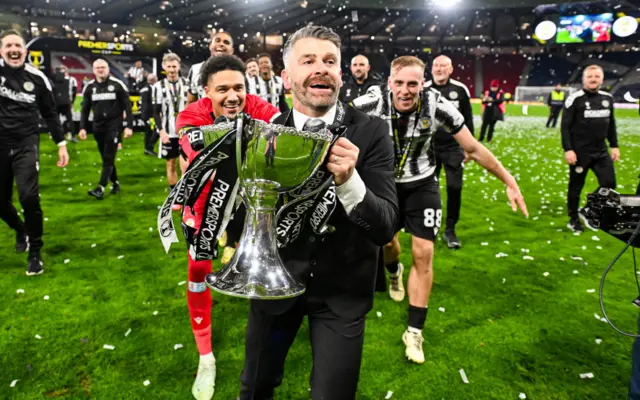Stephen Robinson with the Premier Sports Cup trophy