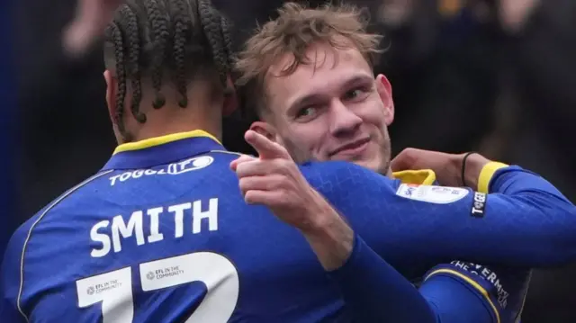 AFC Wimbledon celebrate scoring