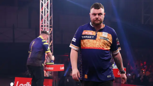 Josh Rock walks off stage for a break