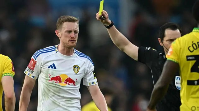 Longstaff receiving a yellow card