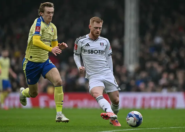 Flynn Downes challenges Harrison Reed
