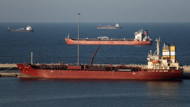 A red oil tanker is pictured in the Strait of Hormuz