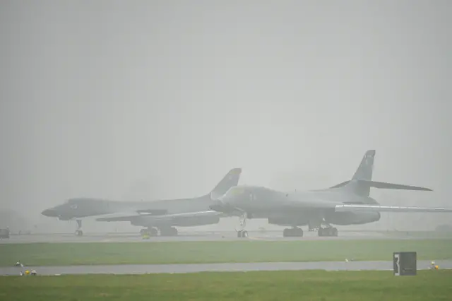 US Airforce Rockwell B-1 Lancer bombers stand in the fog on the apron at RAF Fairford