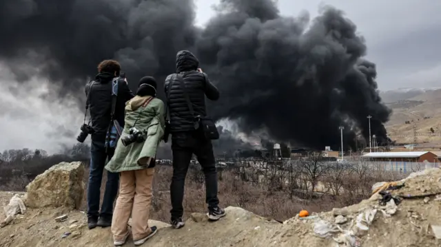 People record smoke rising after a reported strike on Shahran fuel tanks, Tehran