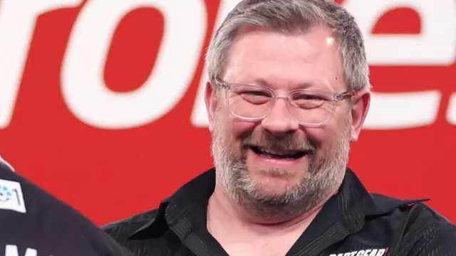 James Wade smiles