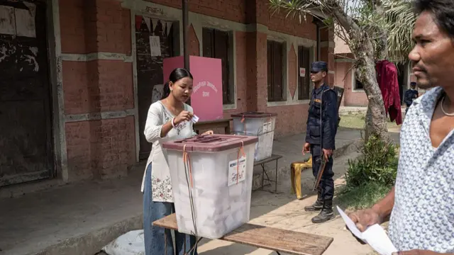 A Nepali voter casts her ballot at a polling station during voting in the country's general election in Jhapa district on March 05, 2026 in Rajgadh, Nepal. The vote is seen as a pivotal test for Nepal's fragile coalition politics and a generation of first-time voters from Generation Z eager for change in the Himalayan nation