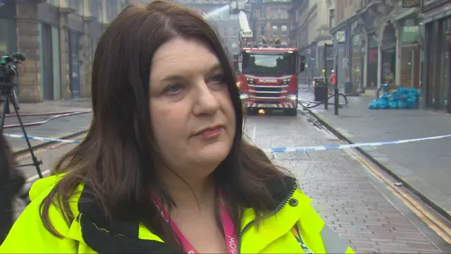 Glasgow City Council leader Susan Aitken looking slightly off camera while wearing a hi-viz jacket
