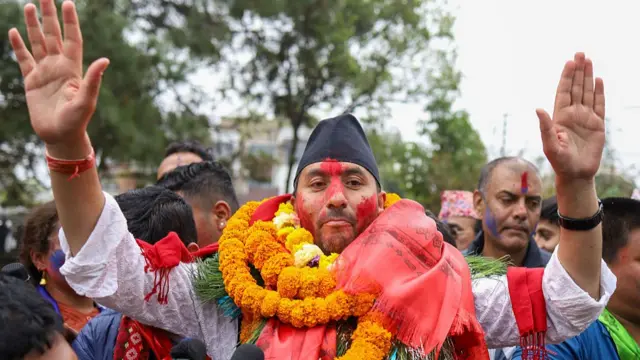 Jagdish Kharel, a candidate from RSP, waves at waves at supporters after being elected as an MP in Lalitpur
