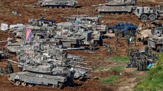 Israeli troops and tanks on the Lebanese border