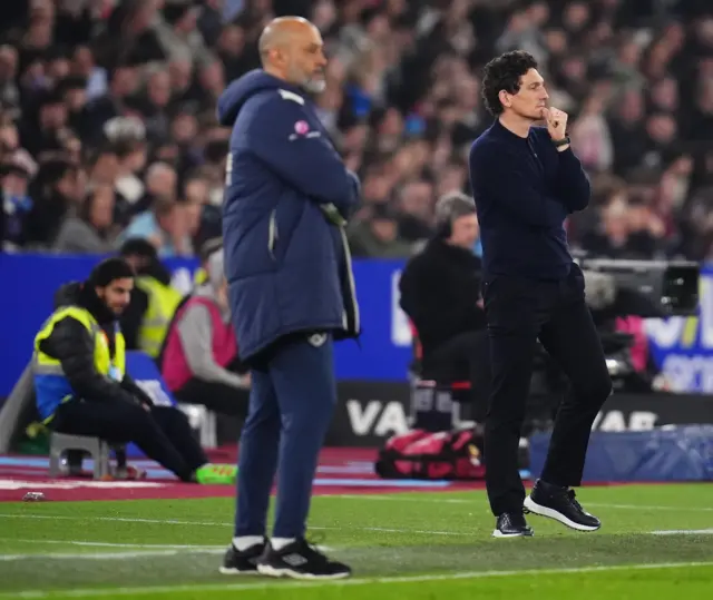Both managers watch on deep in thought