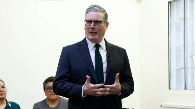 Starmer speaks to a small group at a community centre