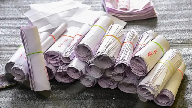 Ballots rolled up during the Nepal 2026 election