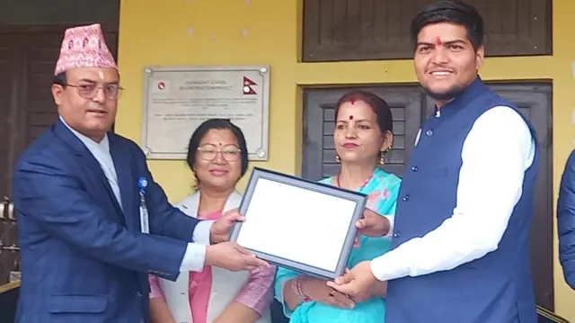 Prashant Uprety receiving the certitifcate from the Election Commission after the offiical announcement of the results