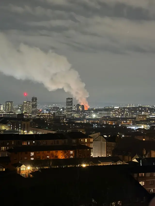 A night-time photo of Glasgow, with the fire clearly visible among the buildings
