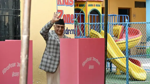 Former PM KP Sharma Oli waving as he casts his vote in the Nepal 2026 election