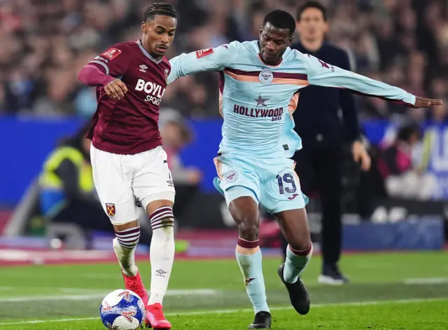 Summerville and Ouattara battle for the ball