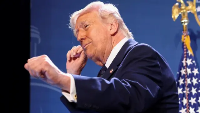 Donald Trump dances at a press briefing