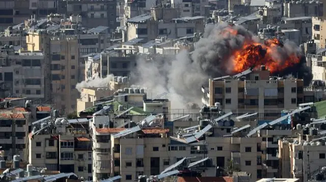 A fireball rises close to residential tower blocks in Beirut