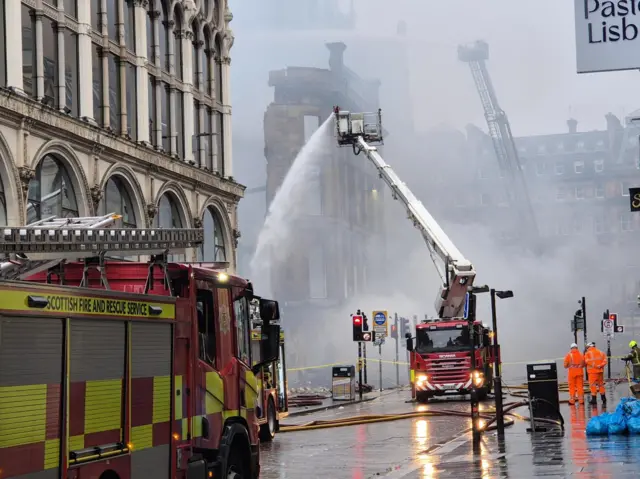 Fire engines dowsing fire
