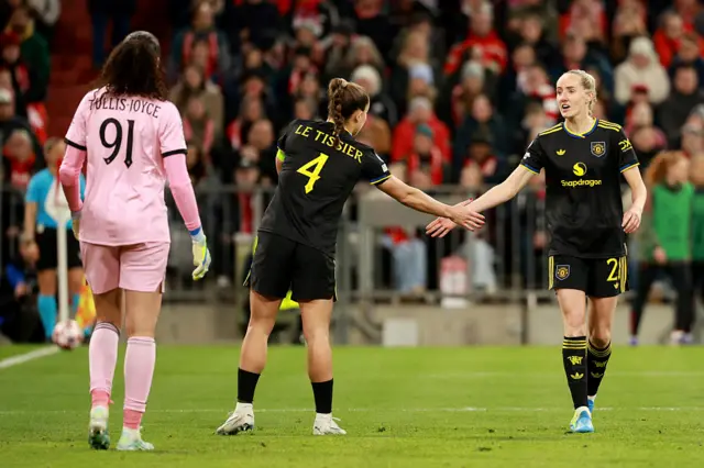 Turner and Le Tissie high five after dealing with another Bayern attack