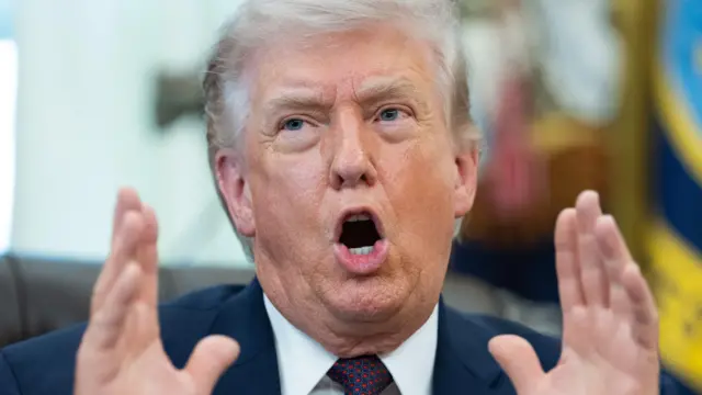 US President Donald J Trump gives remarks during an executive order signing event in the Oval Office of the White House in Washington DC.