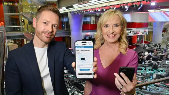Kirkwood and Schafernaker show a phone with an app in the BBC Newsroom