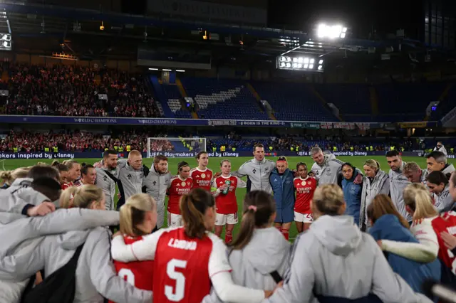 Arsenal gather in front of the away end