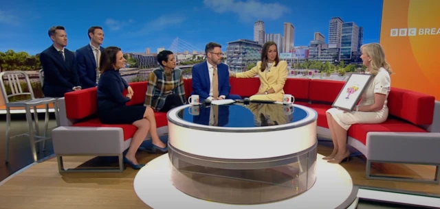 BBC Breakfast team handing Carol a Little Miss Sunshine poster.